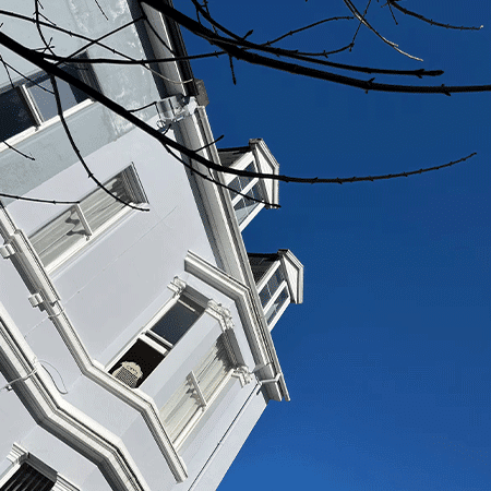 External shot of apartment in sunny skies.